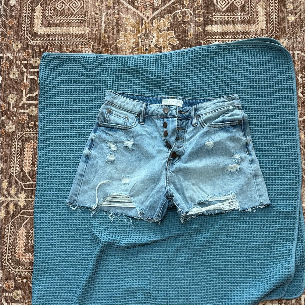 High-Rise Distressed Light Blue Denim Shorts with Frayed Hem